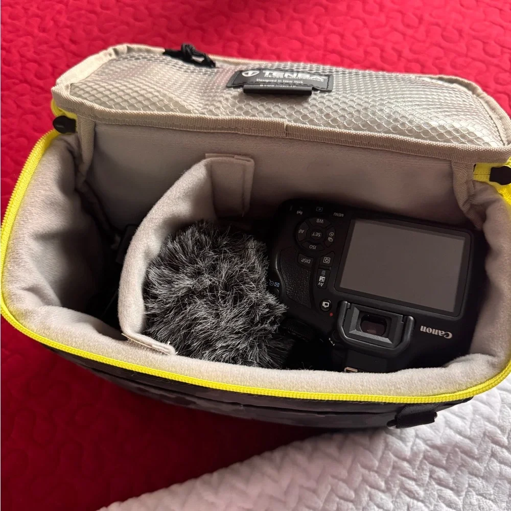 Canon EOS Camera with Black and Yellow Bag